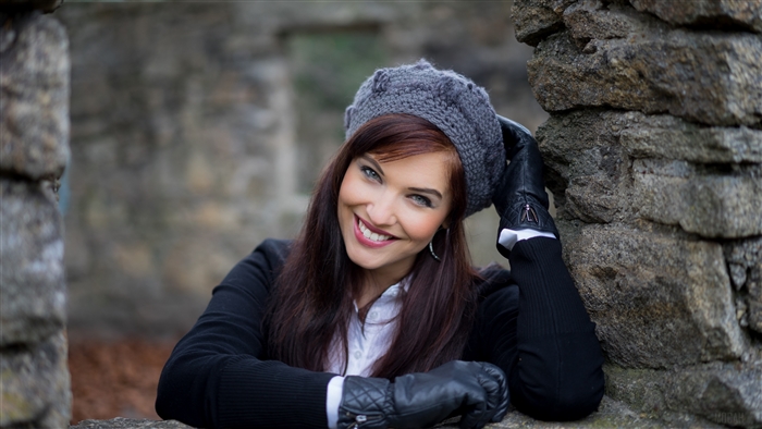 Woman with Blue Eyes and Brunette Hair Wearing a Hat