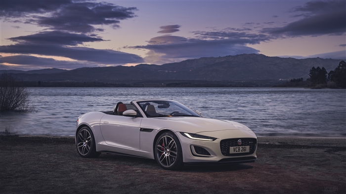 White Jaguar F-Type Convertible by a Lake at Dusk