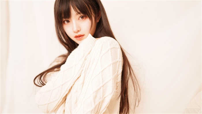 Serene Portrait of a Young Woman in Cozy Sweater