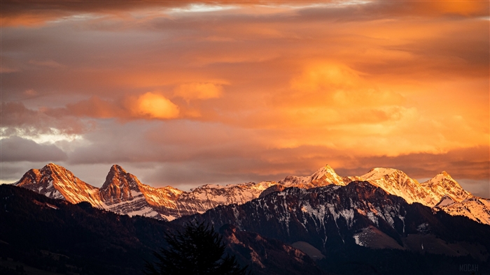 Snow-capped mountains at sunset