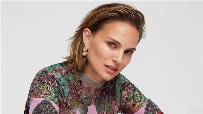 Natalie Portman wearing ornate dress and earrings