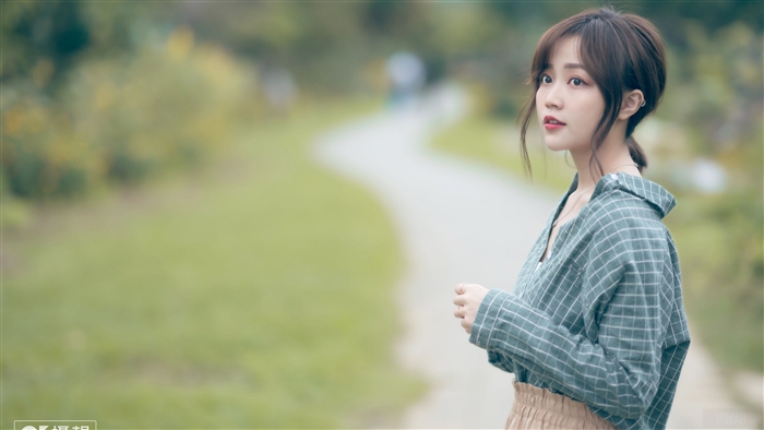 Serene Woman in Soft Green Checkered Shirt 4K