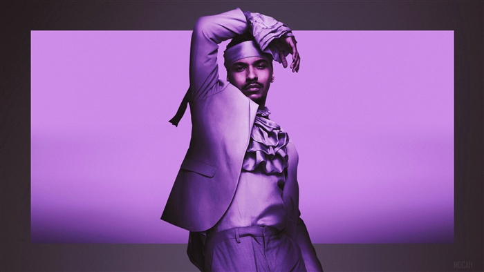 Man in purple suit and ruffled shirt
