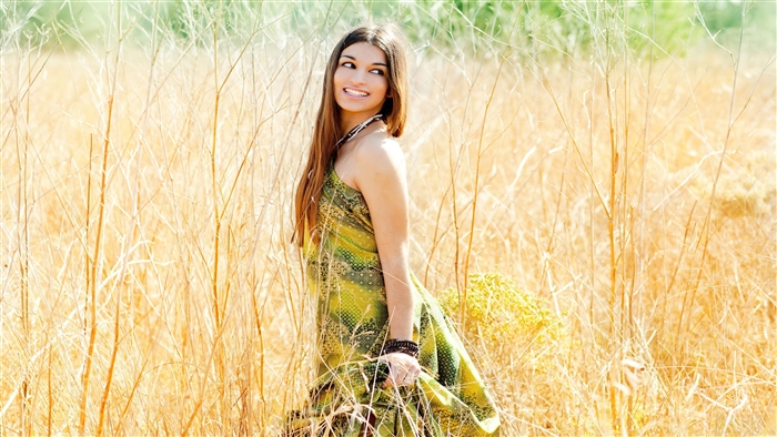 Girl smiling in a field 4K