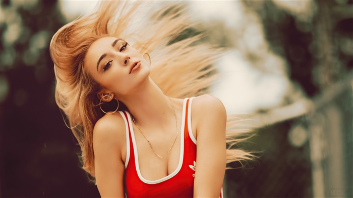 Girl with blonde hair moving outdoors 4K