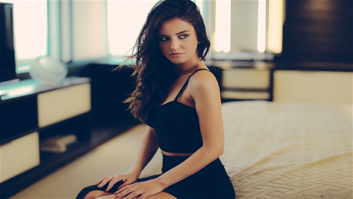 Girl in Black Dress Sitting on Bed 4K