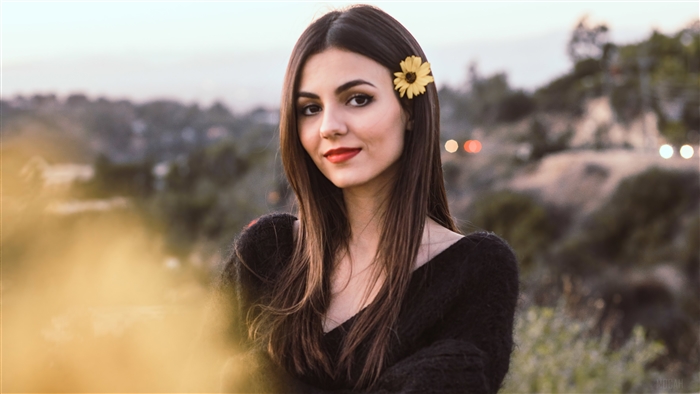 Victoria Justice with a flower in her hair