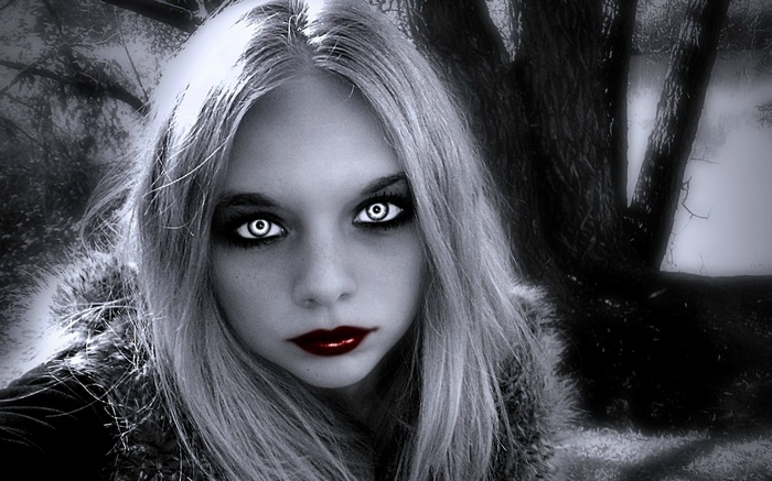 Gothic woman with white eyes and red lips