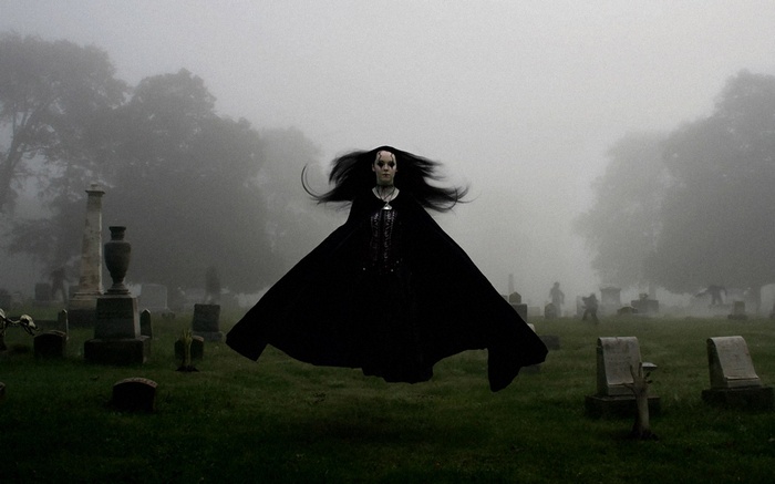 Ghostly Woman Floating in Foggy Cemetery