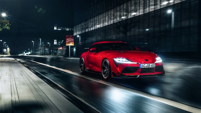 Red Toyota Supra 2020 driving at night