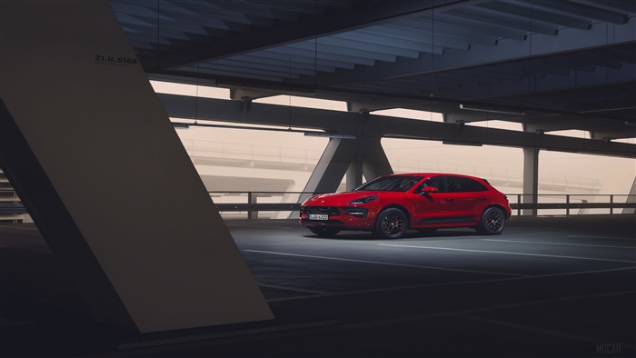 Red Porsche Macan GTS 2020 parked in a parking garage