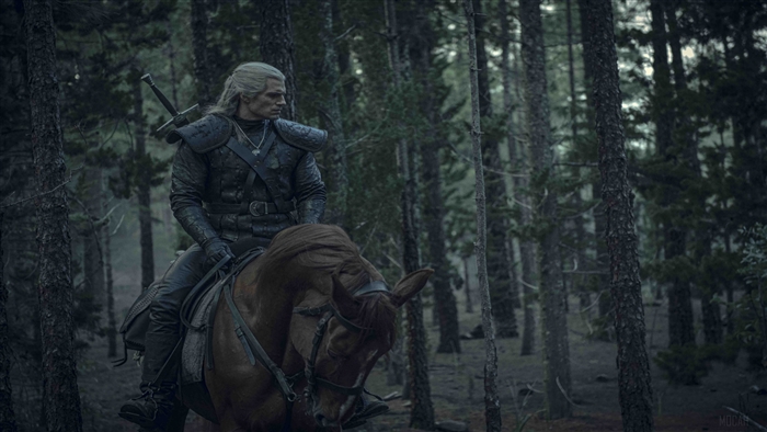 Geralt of Rivia from The Witcher on horseback in a forest 4K