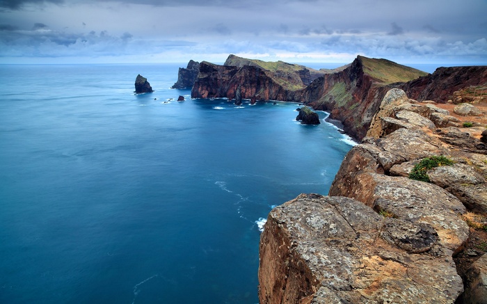 Rocky coastline with blue ocean and dramatic cliffs