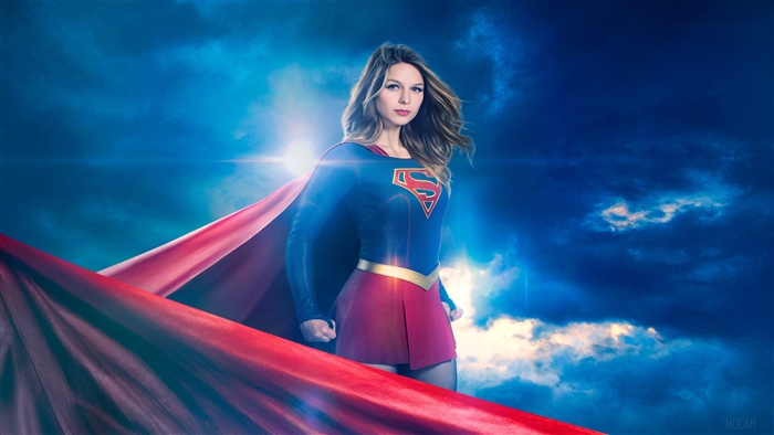 Supergirl in costume with red cape