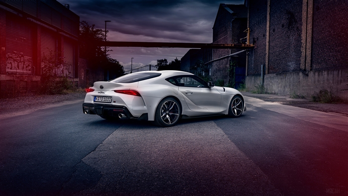 White Toyota Supra parked in an industrial area
