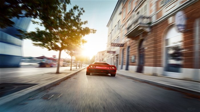 Red Ferrari 288 GTO driving on a street
