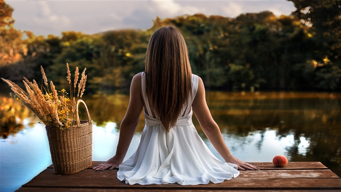Girl in white dress sitting on pier, 4K