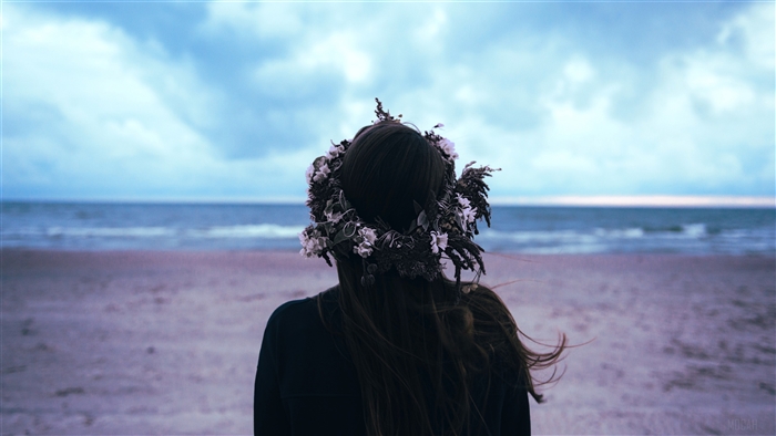 Woman with Flower Crown on Beach
