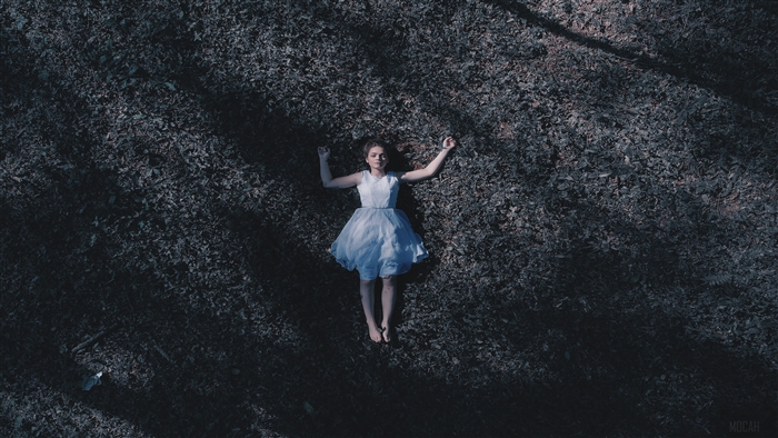 Girl Laying Down On Ground