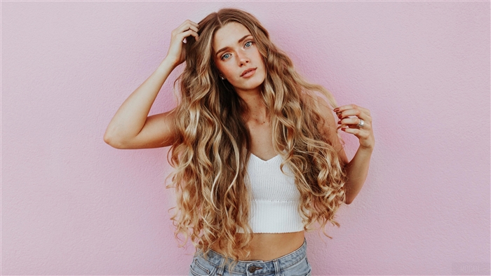 Woman with long curly blonde hair