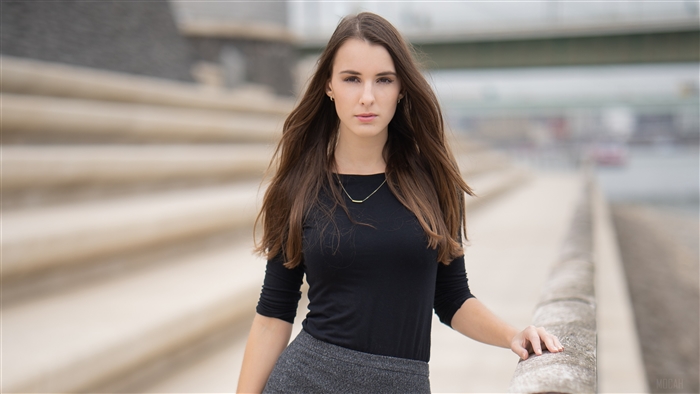 Beautiful Woman in Black Top and Grey Skirt