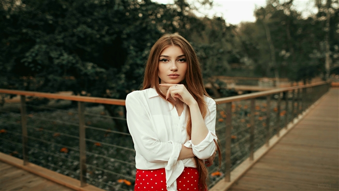 Blonde Girl Hand On Chin Posing
