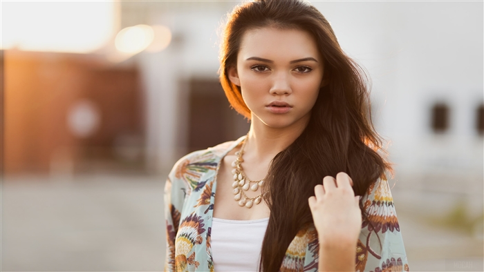 Girl with hands in hair looking at viewer 4K