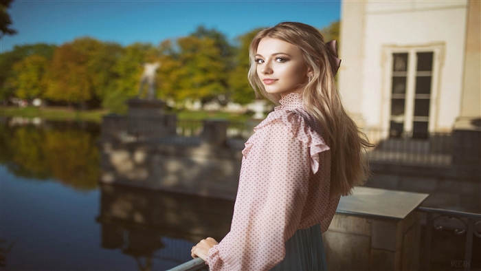 Beautiful Blonde Woman in Pink Blouse