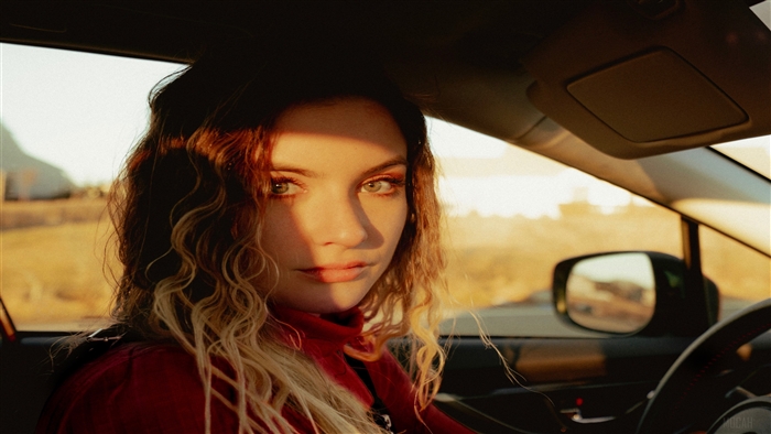 Girl in car with 80s style