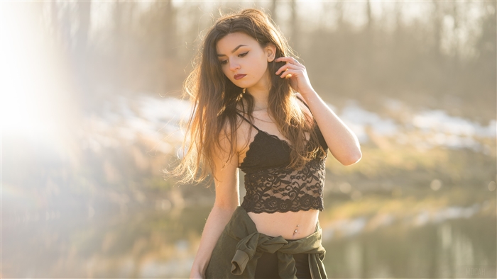 Model with sun rays on face outdoors 4K