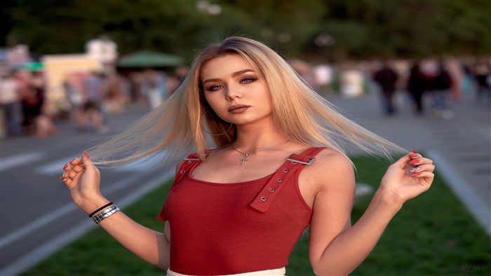 Woman with blonde hair in red top