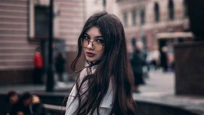 Girl In Glasses Looking Back
