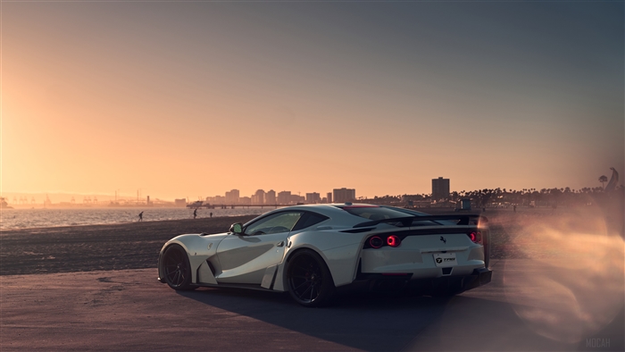 White Ferrari 812 Superfast with smoke at sunset