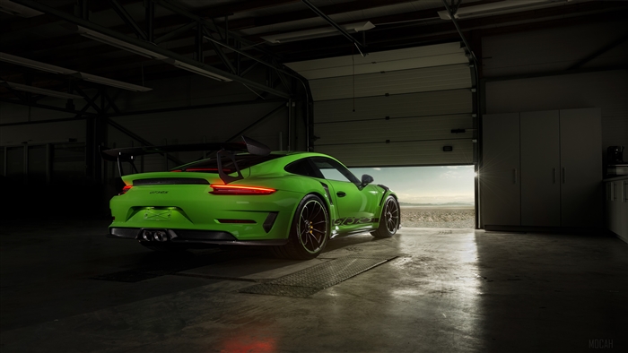 Green Porsche GT3 RS in a garage