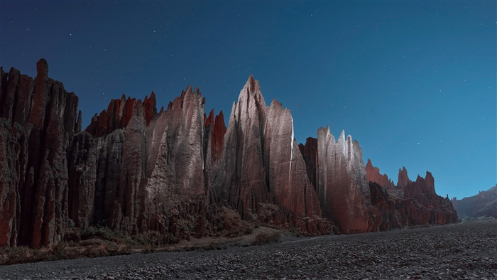 Sharp Rock Mountains under a Starry Night Sky 4K