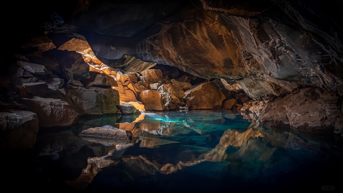 Cave with blue water in Iceland 4K