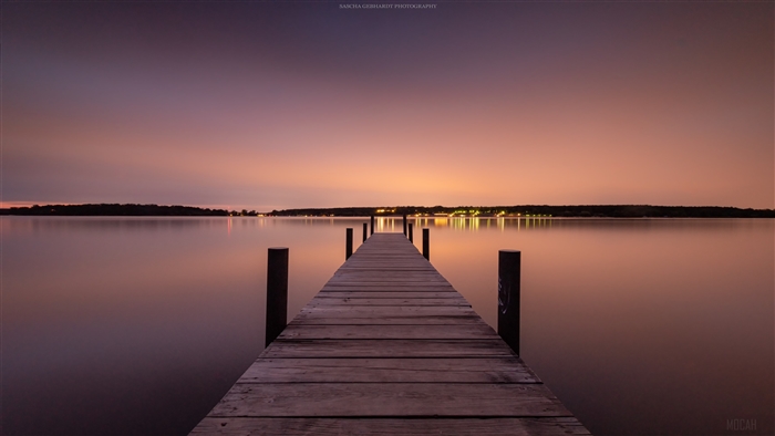 Wooden pier on a lake at dusk 4K