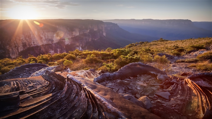 Sunrise over a canyon landscape with rock formations