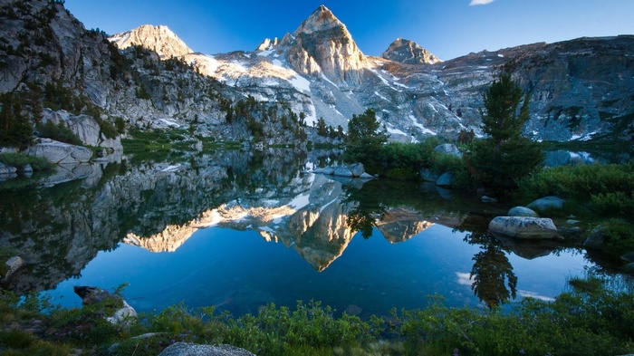 4K Foggy Mountain Peaks Reflecting on a Lake