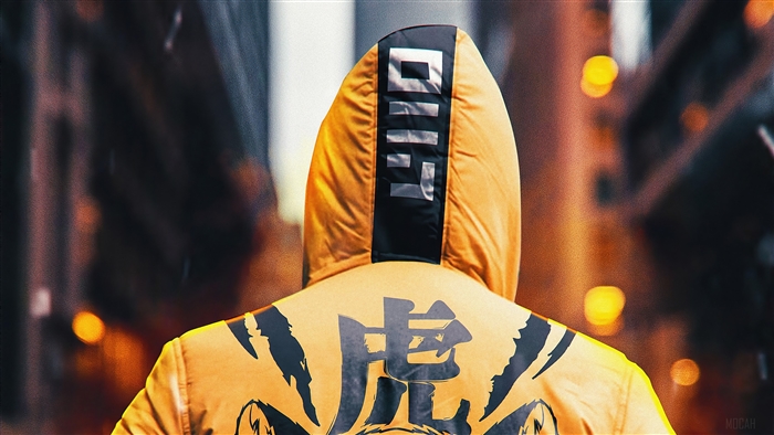 Man in a yellow ninja hoodie with tiger design