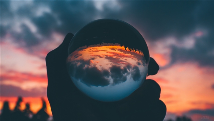 Glass Ball Reflecting Sunset Sky
