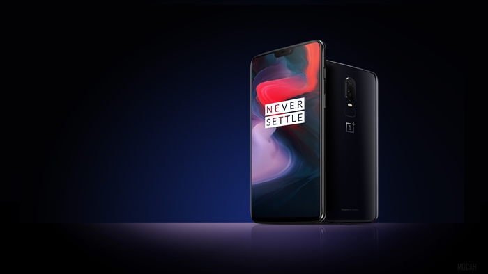 OnePlus 6 smartphone with 'Never Settle' wallpaper