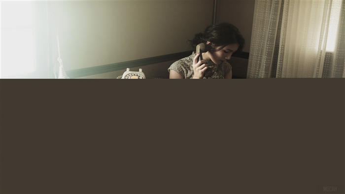 Woman Talking on Vintage Telephone