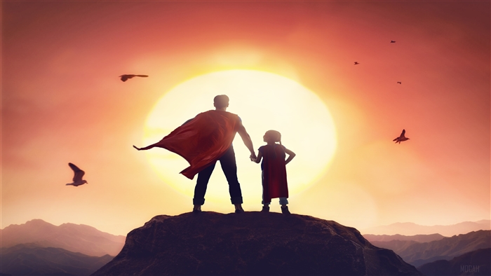 Father and daughter in superhero capes at sunset