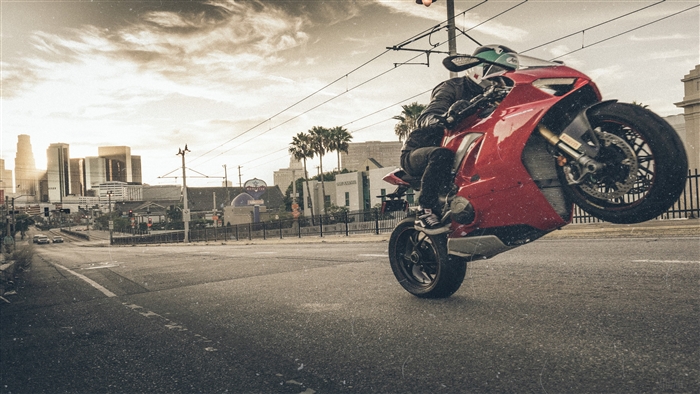 Red Ducati motorcycle doing a wheelie in Los Angeles 4K