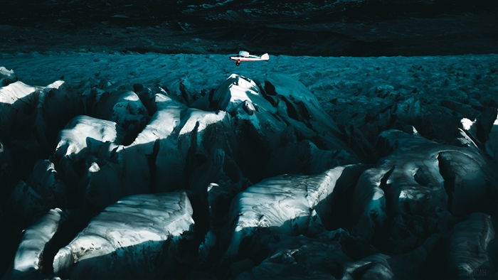 Plane Flying Above Glacial Mountains 4K