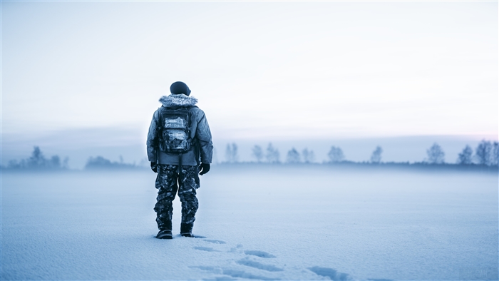 Man in winter snow 4K