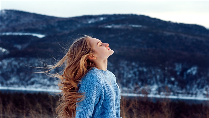 Girl in Blue Sweater in Windy Snowy Mountains 4K