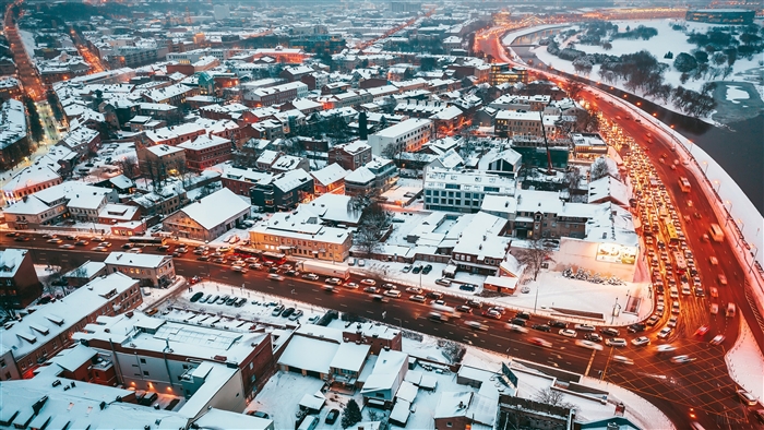 Cityscape Covered in Snow with Traffic