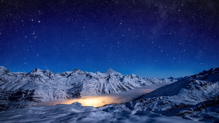 Snowy Mountains Under a Starry Night Sky
